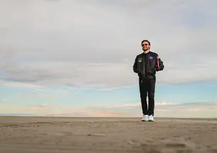 Tralie stands alone with his wonder in the Utah desert.