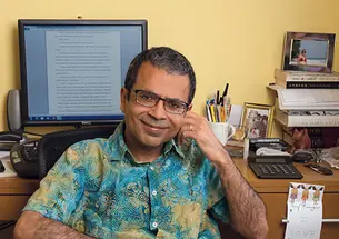 Akhil Sharma ’92 at his desk in his home office in New York City, where he does his writing.