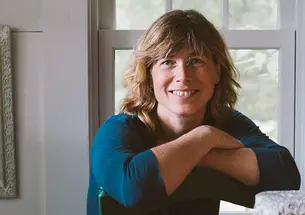 This is a photo of Madeleine Vedel ’89 in front of a window.