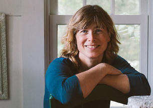 This is a photo of Madeleine Vedel ’89 in front of a window.