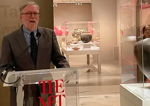 Michael Brown ’72 speaks at The Met in front of the Pueblo pottery exhibit.