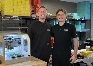 Tavish Rice ’20, left, and his brother Breton at work in a lab.