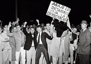 A crowd greeted Fidel Castro at the Princeton Junction train station. Below, after speaking at a conference on campus, Castro stopped to talk with students and others on Washington Road.