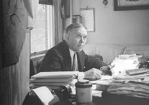 H.L. Mencken writes at his desk in Baltimore in the mid-1940s.