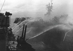 Alan Reed ’40 died after boarding the USS Princeton, in flames, Oct. 24, 1944. He was assigned to the USS Birmingham, shown here fighting the fire.