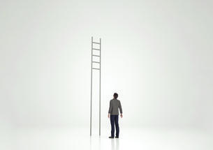 Man looking at ladder with rungs out of reach
