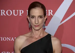 A headshot photo of Vanessa Friedman ’89 in front of a step and repeat at a gala event.