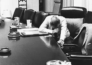 President Lyndon B. Johnson listens to a tape-recorded message from his son-in-law, Marine Capt. Charles Robb, who was in Vietnam, in 1968.