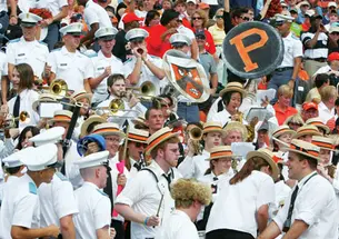 After booing the Princeton band’s halftime show, Citadel cadets surround the band in the stands.