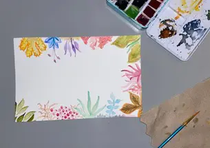 A watercolor painting of flowers reaching in from the edges of the paper.