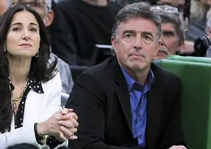 Emilia Fazzalari, left, and Wyc Grousbeck ’83 watch an NBA basketball game between the Celtics and the Miami Heat on Nov. 30, 2022.