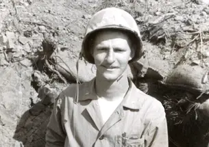 Peter Clapper ’49 in front of his "hole" in Korea. Clapper led a Marine infantry platoon and later suffered from post-traumatic stress disorder.