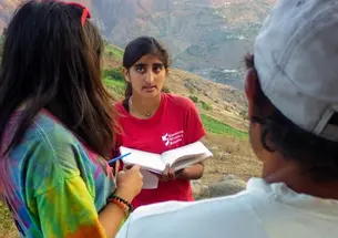 Kasturi Shah â16, center, and Amanda Li â16 talk with one of EWBâs community partners in La Pitajaya, Peru. (Courtesy Joshua Umansky-Castro â17)