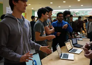 Collin Stedman â15, left, pitches HostShark at the HackPrinceton science fair. (Mary Hui â16/Picture Perfect)