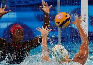 Ashleigh Johnson ’17, left, defends a shot by Australia’s Danijela Jackovich in the Olympic semifinals.