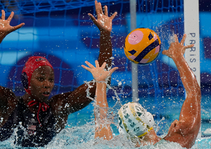 Ashleigh Johnson ’17, left, defends a shot by Australia’s Danijela Jackovich in the Olympic semifinals.