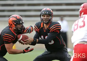 kanoff.png Chad Kanoff ’17, center, in action during his freshman season.