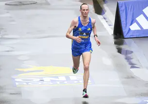 lone runner near the finish line of the Boston Marathon