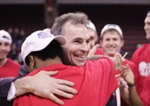 Mike Brennan â94 celebrated with his team in Boston March 12. (Courtesy American University Athletics Communications)