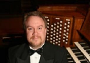 Eric Plutz at the keyboard of the Chapel organ.