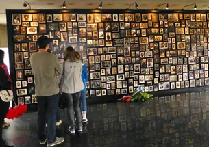 Princeton students learning about the history of Polish Jews view photos at Birkenau, part of the Auschwitz concentration camp in Poland built by the Nazis.