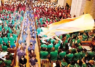 Kites ﬂy overhead as freshmen leave the University Chapel to begin the Pre-rade