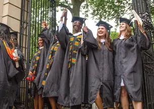 Graduates from the Great Class of 2015 rejoice as they exit campus through FitzRandolph Gate.