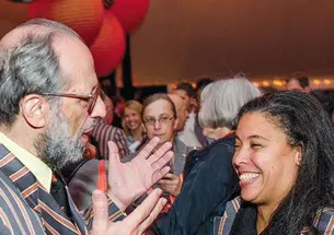 Eli Arthur Schwartz *60 and Patrice Jean *99, adorned in their Association of Princeton Graduate Alumni Reunions jackets, enjoy a conversation during the “Many Minds, Many Stripes” conference.