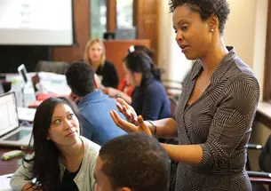 Associate Professor of Psychology and African American Studies Stacey Sinclair, shown here talking with students in a course on prejudice and social stigma, is among many Princeton faculty members whose teaching and research investigate issues of race and