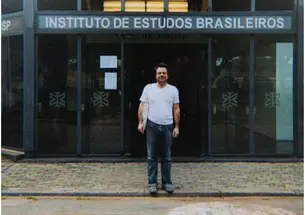 Dylon Robbins, standing in front of the Instituto de Estudos Brasileiros at the Universidade de São Paulo in Brazil, where he is conducting research for his dissertation. 