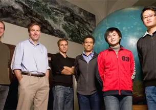 Newly appointed geosciences professor Jeroen Tromp *92, second from left, meets with members of his research group in Guyot Hall.
