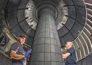Technicians working inside a fusion device