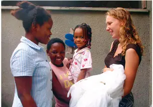 Recent graduates like Kimberly Bonner ’08, pictured here in Tanzania distributing bed nets to combat malaria, have often engaged in international public service. Now our incoming freshmen will have a chance to do so, too.
