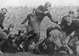 This is a black-and-white photo of a football tackle from 1922.