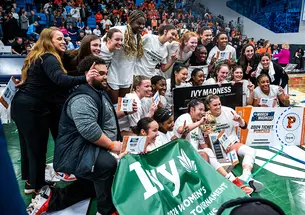 Princeton women's basketball team poses for celebratory photo on the court