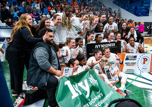 Princeton women's basketball team poses for celebratory photo on the court