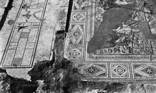 Using glued cloth and boards, wooden poles, concrete, and steel reinforcements, archaeologists removed scores of mosaics from the site.