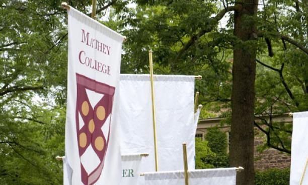 George Lan ’09 with the standard of Mathey College.