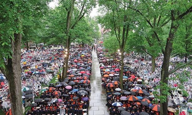 The front campus was filled with umbrellas and ponchos in this view of Commencement from Nassau Hall.