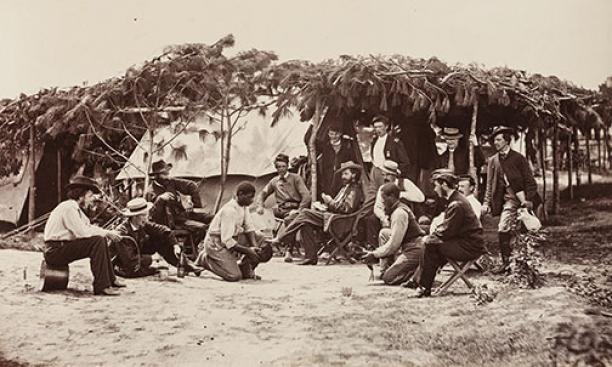 A Fancy Group, Front of Petersburg, August 1864: A pair of “contrabands” — freed slaves who provided logistical support to the Union side — ready their champions for a cockfight. “Such displays were always ludicrous,” notes Gardner, “and wer