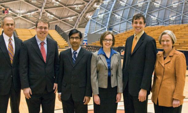  President Tilghman, right, and graduate school dean William Russel, left, with students honored on Alumni Day: From left are Jacobus Fellowship recipients Joseph Moshenska, Vaneet Aggarwal, and Melinda Baldwin; and Pyne Prize winner Connor Diemand-Yauman