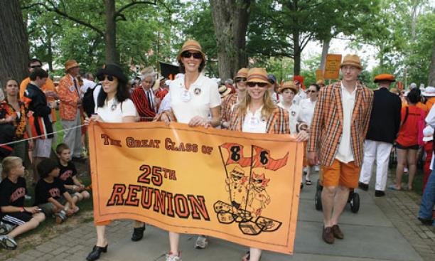 Carrying the 1986 banner are, from left, Kiku Loomis, Lisa Greenberg, and Clare Zagrecki Riley, with Reeve Miner Washburn following behind and and Michael Demko pulling a wagon.