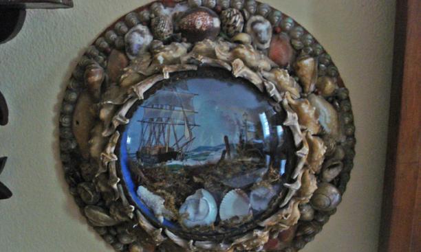 This Victorian shell souvenir with a painted scene under bubble glass is from an Arizona eBay seller.