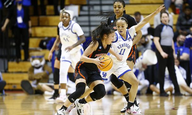 Princeton Tigers guard Kaitlyn Chen ’24 drives past Kentucky Wildcats guard Jada Walker during the NCAA women’s basketball tournament first round game in Bloomington, Indiana, on March 19. 