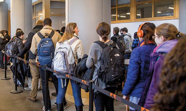 Students line up in Frist Campus Center to receive the meningitis B vaccine.