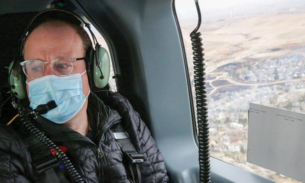 Polis flies over his hometown of Boulder 