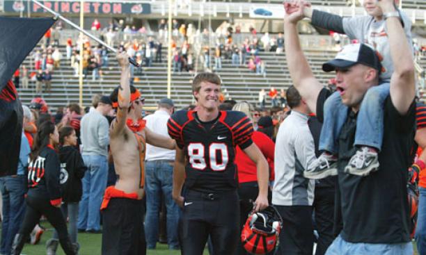 Students and alumni stormed the field to celebrate the Tigers’ stunning win with the players, including Luke Taylor ’13.