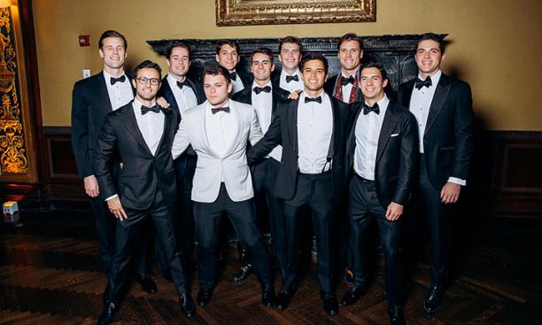 A group of guys in tuxedos.