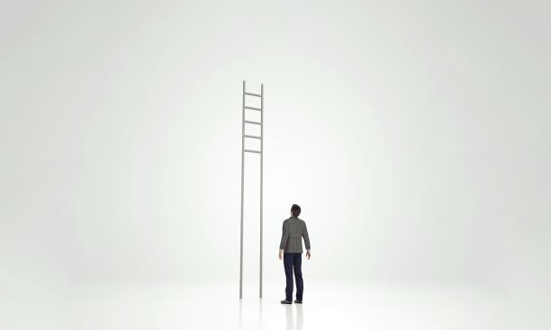 Man looking at ladder with rungs out of reach