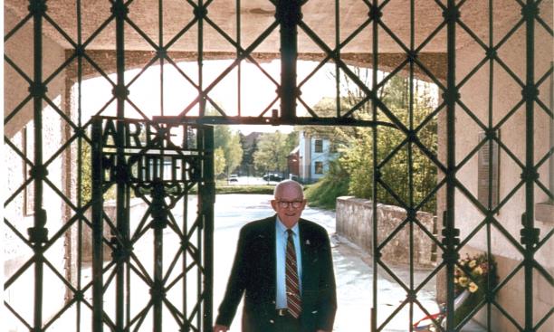 Alan W. Lukens '46 at the main entrance gate to the Dachau concentration camp.